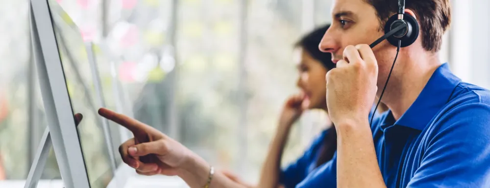 Call center workers, assisting customers over the phone