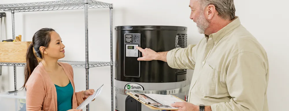 Contractor showing a customer a Heat Pump Water Heater (HPWH)